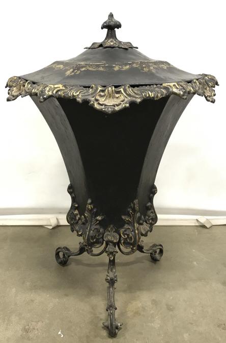 Vintage Rococo Style Cast Metal Lidded Urn: Vintage Rococo Style Cast Metal Lidded Urn With Tripod Base, Shell and acanthus leaf raised design and black and gold toned painted finish, chips to painted finish, measures approximately 30 inches ta