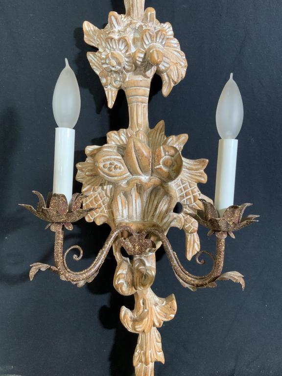 Vintage Italian Hand Carved Sconce: Circa 1990, marked for made in Italy hand carved wood depicting fruit floral swags and leaves, gold on brown speckled metal arms, two light candelabra style, measures ht 25 inches width 10 inches dept
