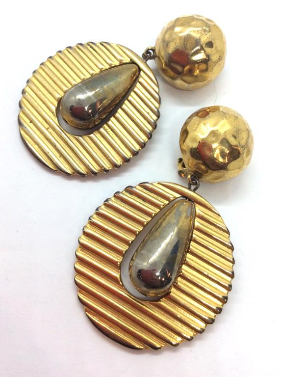 GIVENCHY Fashion Ear Clips: Gold and silver toned metal, oversized statements earrings, hammered style orbs with hanging pendant with tear drop shaped charm. Measures approx 3 in by 2 in. Fashion accessories, Statement jewelry, 