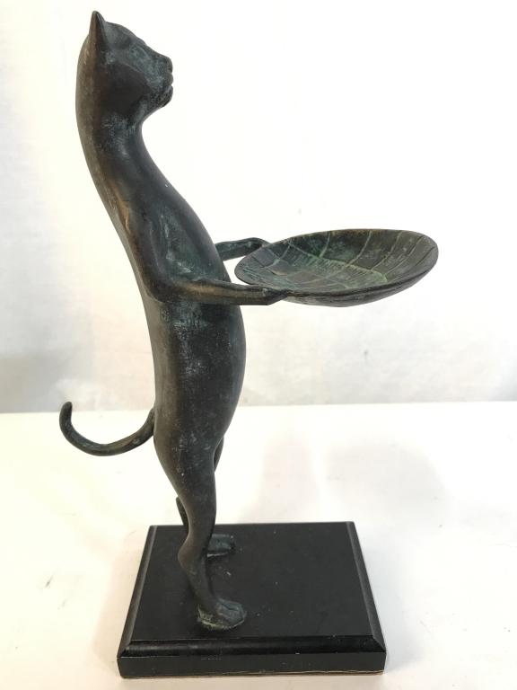 Metal Cat Trinket Dish: Trinket Dish depicts a cat standing on its hind legs holding a shell shaped tray. Piece measures approx 12 inches tall 5.5 inches deep 4 inches wide. trinket dish, animal statuary tableware, decorativ