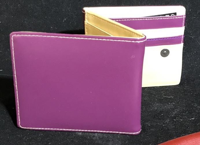 Chilean Leather Billfold Wallet: Purple, smooth calf leather, Crafted in Santiago, Chile. Tag reads ‘ Pieza esclusiva Hecha en Chile’. Never used. Comes in protection pouch. Zipper for coins, ID slip, CC section. Snap closure. 4 