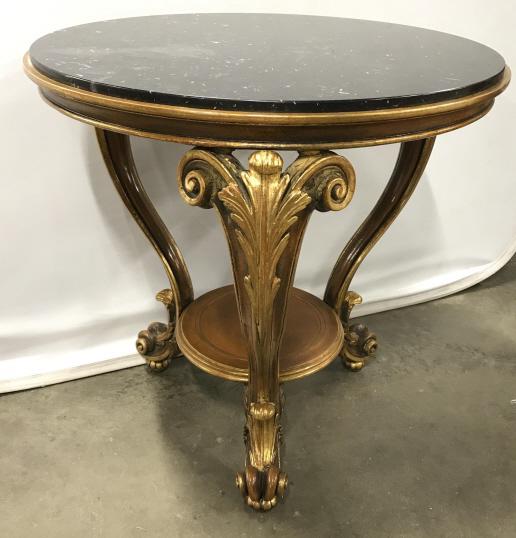 French Louis XV Style Marble Topped Guéridon Table: French Louis XV Style Marble Topped Carved Guéridon Table with black marble top, carved gilt wood tripod base with scroll and acanthus leaf design, small chips to edge, measures approximately 28.5 in