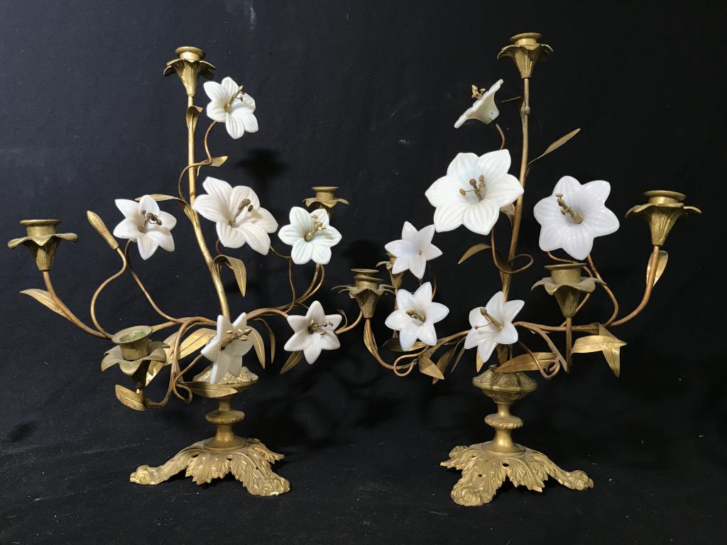 Pair French Floral Ormolu & Porcelain Candelabra: Pair of gilt bronze, ormolu candelabra with porcelain flowers. Each marked with letter ‘S’ On reverse sude Each measures approx 19 inches in height by 17 inches in width by 7 inches in depth. Each