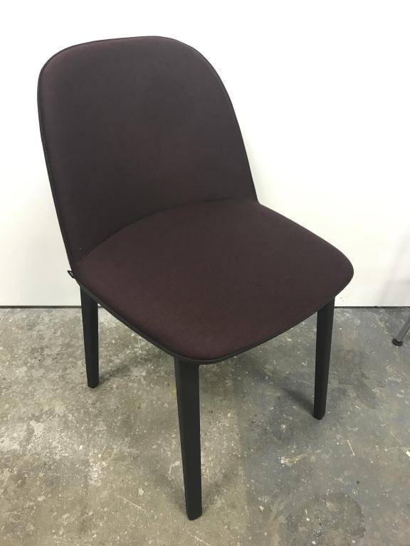 VITRA Softshell Side Chair: The Vitra Softshell Side Chair, whose gentle contours are defined by its soft dark cranberry toned upholstery, provides exceptionally comfortable seating and compact dimensions: vertical ribs conceale