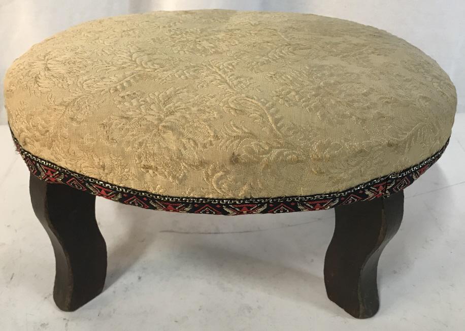 Antique Footstool W Brocade Fabric Upholstery: Antique, Possibly late 19th Century, petite wooden Footstool, foot rest, with Brocade Fabric Upholstered Cushion-Top. Oval in shape. Cream on cream, possibly silk, Brocade Fabric with red and black to