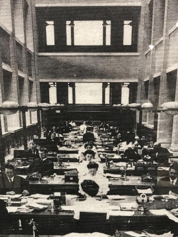 B&W Lithograph Of Frank Lloyd Wright Larkin: Vintage black & white tone lithograph depicting architectural interior of Frank Lloyd Wright’s Larkin building interior with figures working along bottom. Possibly an offset lithograph. Print is set