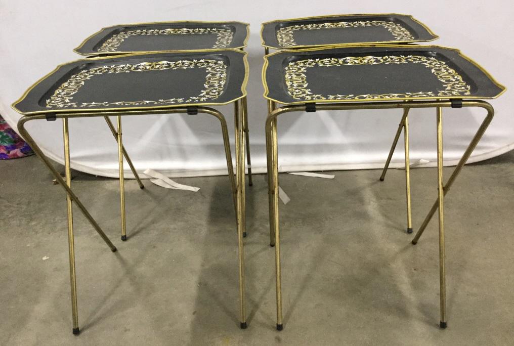 Set 4 Vintage Folding Metal Tray Tables: Lot includes 4 tray tables. Each are black and gold toned. Tops of each have painted intertwined vine detail. Tray tables, tv Tables, television tables, snack tables, folding tables, vintage tables. E