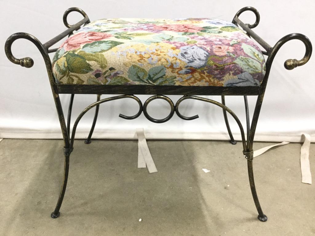 Vintage Cushioned Metal Bench: Bench is metal. Piece contains multi toned floral and leaf detailed upholstery. Metal Bench, Upholstered Bench, foot stool, footrest. Measures approx 22 inches long 18 inches tall 14 inches deep. 6