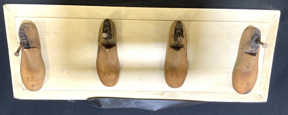 Oddity Antique Shoe Forms into Coat Rack: Four antique wood show forms mounted with hand forged iron nails onto painted wood board, fabric for wall hanging, unusual coat rack, wall display, antique cobbler forms, measures htb11 inches width a