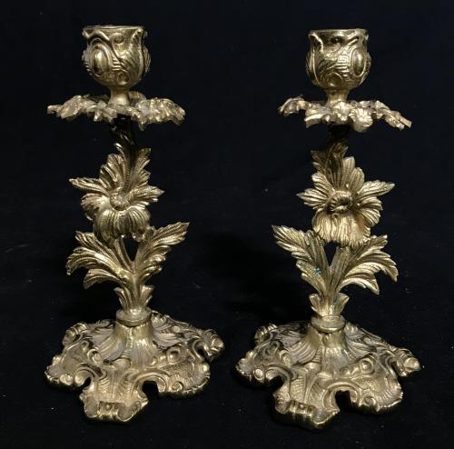Pair Vintage Rococo Style Brass Candlesticks: Pair Vintage Rococo Style Brass Toned Metal Candlesticks With scroll and leaf design measures approximately 7 inches tall x 3.75 inches in diameter, marked illegibly on underside. Vintage Pos Antique 