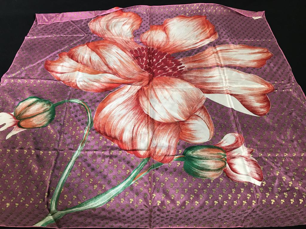 Anne Klein Lrg Floral Silk Scarf: Large square Scarf by Anne Klein, 34 x 34 in. Purple background with repeating gold leaf pattern and red center flower. Label reads, Anne Klein for the Vera Companies, All Silk, Tout Soie, Made in Jap