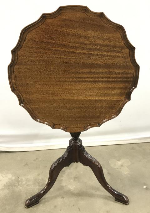 Vintage Tilt Top Table With Pie Crust Boarder: Vintage Possibly Antique Wooden Tilt Topped Table with pie crust edge and pad footed, carved tripod base, measures approximately 17 inches in diameter x 21.5 inches tall, nicks to base. Vintage Table,