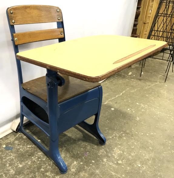 Vintage Children’s School Desk: Desk is vintage. Appears to be metal and wood. Piece is possibly adjustable. Piece measures approx 18 inches wide 25 inches tall 23 inches wide. Piece has some wear. kid's school desk, school room dec