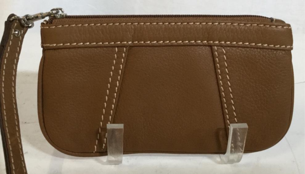 Leather Wristlet clutch: Zipper Closure, brown leather, neat stitching. Lined interior with chain design. Handle is removable , strap is 6 in. long. Measures 7 1/4 x 4 in. Wristlet, Leather Pouch, Wrist Bag, Change Purse, Bro