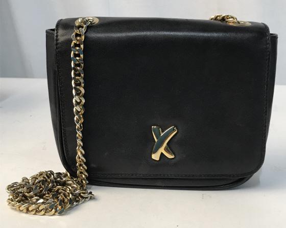 VINTAGE BY PALOMA PICASSO MINI CROSSBODY BAG: Miniature crossbody bag by Paloma Picasso. Measures approximately 5 inches tall by 7 inches wide. Vintage wear. Gold toned metal chain and hardware. Magnetic closure. Inner lining reads By Poloma Pica