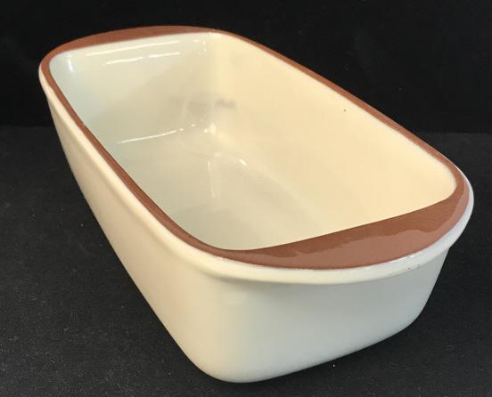 V STYLE-EYES BY BAUM BROS. Earthenware Breadpan: Breadpan by Baum Bros. Bottom reads Style-Eyes by Baum Bros. NATURALS COLLECTION DISHWASHER, MICROWAVE, AND OVEN SAFE. MADE IN CHINA. Measures approximately 10.5 inches long and 5 inches wide. Bradlan