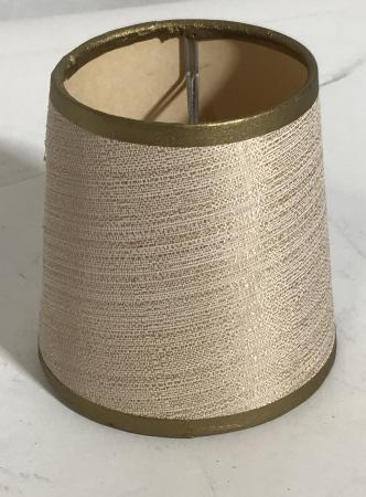 Clip On Mini Lampshade, Chandelier Shade: Gold and cream hardback Shade, Funnel shape. Contemporary Style. Top diameter 3 in., bottom diameter 4 in. Lighting Accessory, Mini Lamp Shades, Chandelier Mini Shades, Gold & Cream, Mini Lamp Accesso