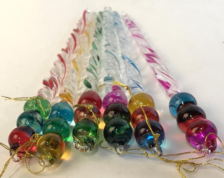 Set 6 Multicolor Handcrafted Glass Ornaments: Twisted Clear glass icicles which convert into colorful ball shapes. Hand Formed. the clear glass icicle has a colorful line that twists down the center. Each with different color; red, blue, yellow, 