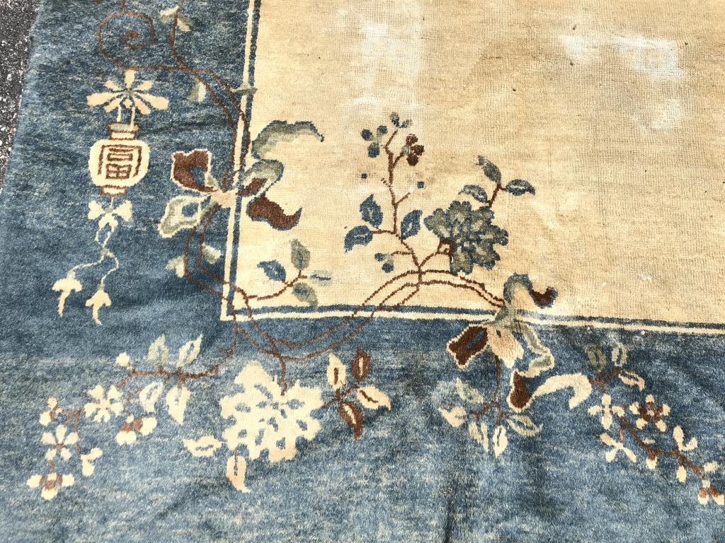 Vintage Chinese Art Deco Handmade Wool Rug: Rug is vintage possibly antique. Contains floral, vase, vine & leaf detail. Contains tones of brown, blue, sand, & light blue. Measures approx 138 inches long 106 inches wide. Rug is handmade. Contain