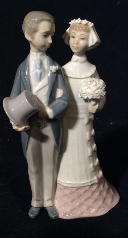 Lladro "Bride & Groom" #4808 Porcelain Figural: LLADRO “BRIDE & GROOM” Glazed Porcelain Figurine #4808 Featuring a bride holding a bouquet standing with her groom who is holding his hat. Sculptor: Julio Fernández Made in Spain Issued in 1972 R