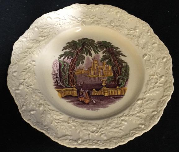 19th Century English Ironstone China Plate: Decorative China plate circa 19th century. Measures approximately 8 inches diameter. Bottom reads MASON’S PATENT IRONSTONE CHINA AMBERLEY OAK ENGLAND. Illegible markings present. Textured border des