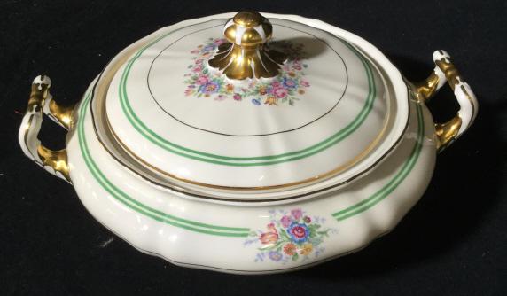 Vintage Musetta Ceramic Tureen: Possibly ceramic porcelain. Bottom reads K&A KRAUTHEIM SELB BAVARIA GERMANY MUSETTA. Approximately 9.5 inches diameter. Printed flowers and gold toned accents on Vessel. porcelain tableware, tureen so