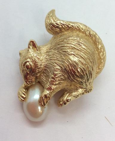 Gold Toned Metal Squirrels Brooch Pin: Gold toned metal, Sculptural Figure Of squirrel holding pearl style cabochon, comes on card which reads RICHELIEU, possibly not original card, squirrel not marked, Measures approx 1 in by 1 1/2 in. Fa