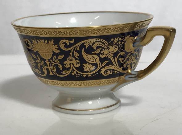 Antique Demitasse Hutschenreuther Porcelain Cup: Hand Painted Hutschenreuther Hohenberg Bavarian Demitasse Cup. Hallmarked on underside. 1814-1914. Additional crest with letters CM and ARTIST SIGNED initial of ‘M’ with # 618656. Gold Embossed De