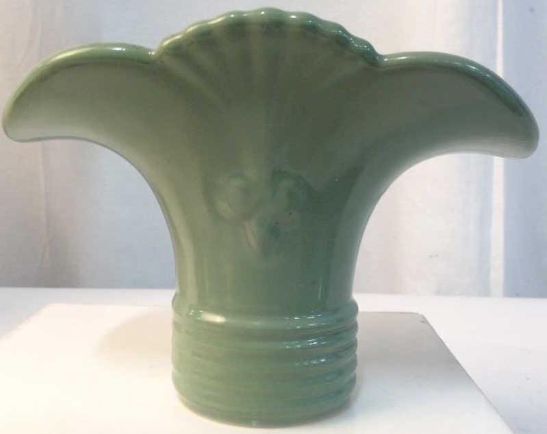 Green toned Ceramic Vase: Green glazed ceramic with Fleur de Lis design, wide mouth with holes for stems around large opening, measures approx 5 in 7 in by by 5 in. vintage design, shelf piece, tableware, vase vessel, mantle p