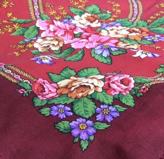 Vintage Floral Fringe Shawl, Made in Russia: Wool shawl that has wool yarn border fringe. Hand Crafted Detail. Center Circular Floral Design, Light moss green disc with bold pink, purple, & orange roses. Red background. Label reads ‘www.platki