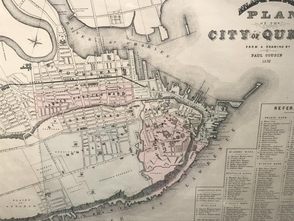 Framed Map Of Late C.19th Quebec City: From a drawing by Paul Cousin from 1875. Map is matted and set behind glass in wood frame. Measures approx 20 inches in height by 23.25 inches in width with frame. Decorative wall art, antique map rep
