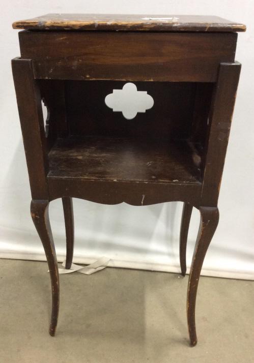 Vintage Wooden Side Table W Lidded Compartment: Table is vintage & wooden. Piece is chocolate toned. Contains Lidded compartment at top. Piece measures approx 34 inches tall 17 inches wide 12 inches deep. Contains evident wear and scratches. home f