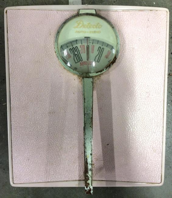 Vintage Pink Toned DETECTO Bathroom Scale: Scale is pink toned. Piece is marked DETECTO on scale face. Piece is pink and cream toned with black toned numerical digits. Piece measures approx 11.5 inches long 11 inches wide 2 inches tall. bathro