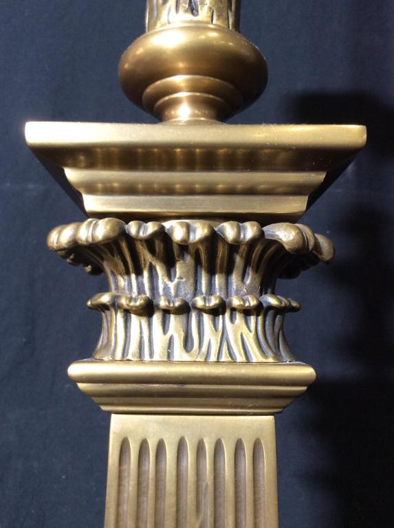 Pair Gold Toned Brass Lamps: Lamps are gold toned and appear to be brass. Pieces measure approx 37 inches tall 8 inches square at base. Each piece contains gold toned finials. Table lamps, side table lamps, end table lamps. home