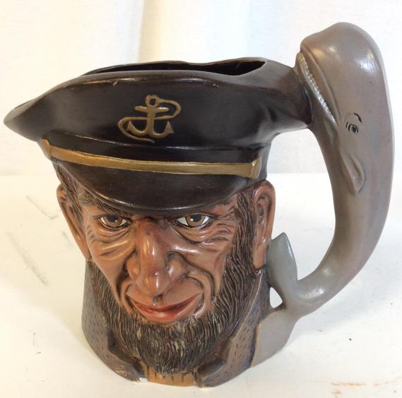 Painted Sailor Mug 'Moby Dick': Mug appears to be hand painted. piece is possibly ceramic, Possibly Plaster. Piece contains painted whale handle. Piece measures approx 7.5 inches tall 9 inches wide with handle. toby mug, porcelain,