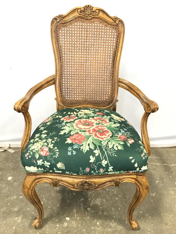Pair Carved Caned Back End Chair W Floral Detail: Chairs have intricately carved wooden detail. Seat has multi toned floral and leaf detail with tones of green, pink, blue, & cream. Backrest Of Chair is caned. Measures approx 39 inches tall 23 inches