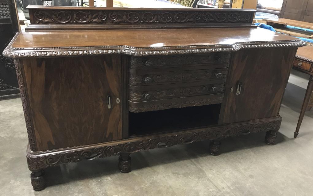 Victorian Style Carved Wooden Sideboard Credenza: Victorian Style Carved Wooden Sideboard Credenza, Possibly Vintage Spanish, in dark toned wood with intricate carved scrolled leaf design around boarders, footed base and drawers, some surface scratch