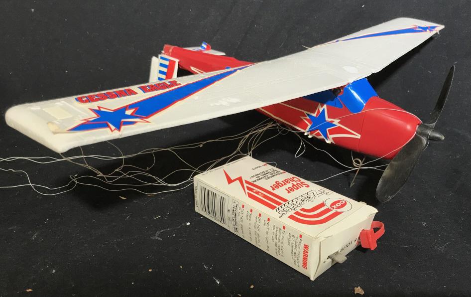 COX EX ELECTRICS CESSNA EAGLE Toy Model Plane: Piece appears to be plastic and styrofoam. Piece includes wings, plane body and charger Piece has 23 inch wingspan and is 16 inches is length. Includes original box. Tail wings appear to need repair. 