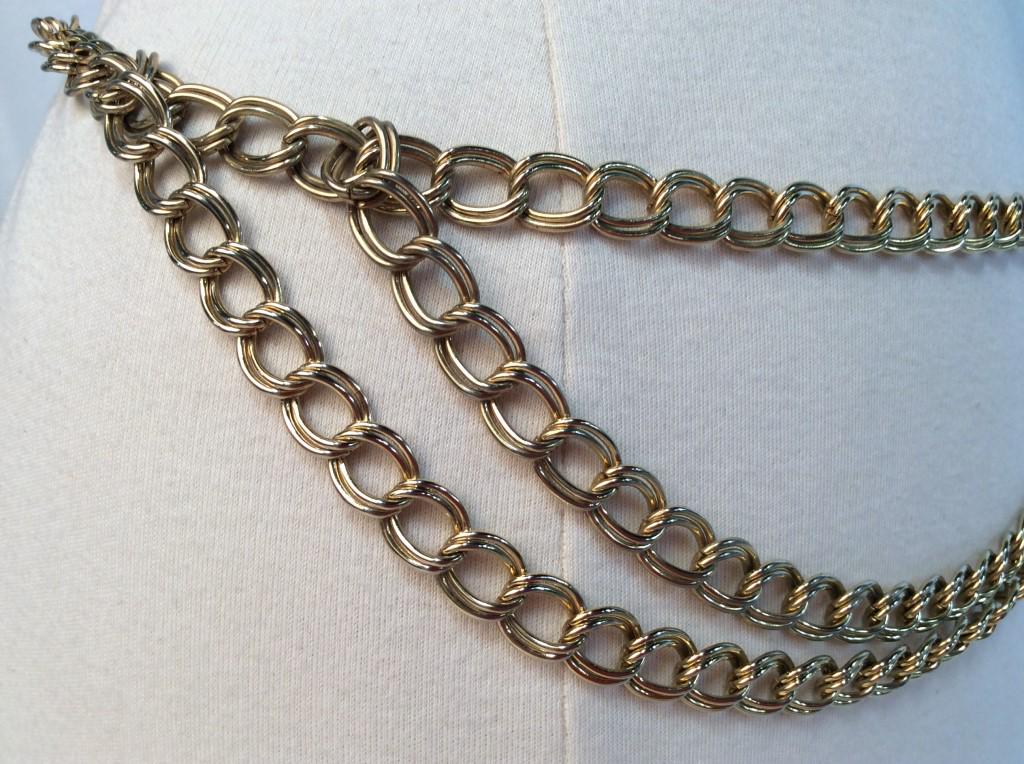 Gold Tone Multi-Chain Fashion Belt: Early 2000s multi-chain fashion belt, gold tone metal with end tassel. Lobster clasp Claw closure. Measures approx 36 inches fully extended. Fashion accessory, estate fashion, vintage fashion belt, we