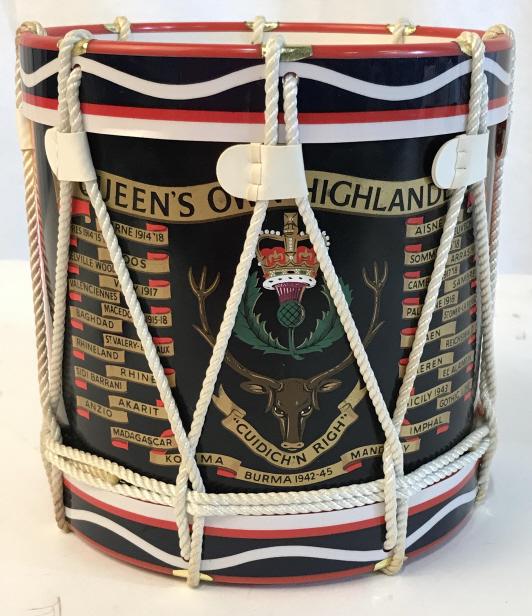 Marching Band Scottish Drum Ice Cooler, Vintage: Painted Ice Bucket reads ‘Queens Own Highlander’ ‘ Cuidich’ N Righ’ Decorated with drum ropes in woven decor pattern. Lid reads ‘Regimental Replicas England’ . Missing knob on bucket lid