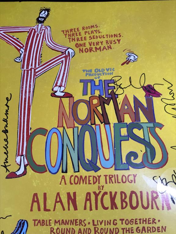 Signed ‘The Norman Conquests’ Comedy Theater Print: Poster print on board of the comedy trilogy ‘The Norman Conquests’ by Alan Ayckbourn. Poster is signed multiple times, illegibly, possibly by cast/crew. Measures approx 22 inches in height by 14 i