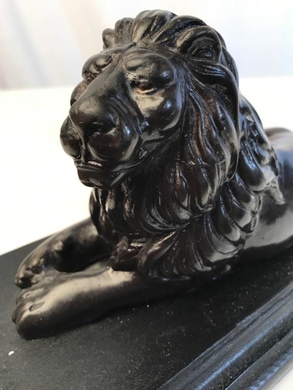 Composite Reclining Lion Wood Base: Lion figural, decorative accessory, animal statuary, book end, decorative arts and accessories, measures app ht 6 inches, length 11 inches width 6 inches