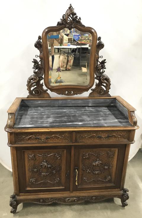 Poss 19th Century French Rococo Style Vanity: Poss 19th Century French Rococo Style Vanity with mable top, intricately carved wooden floral, leaf and scroll designs throughout, and brass toned metal drawer and door pulls, key included, some water