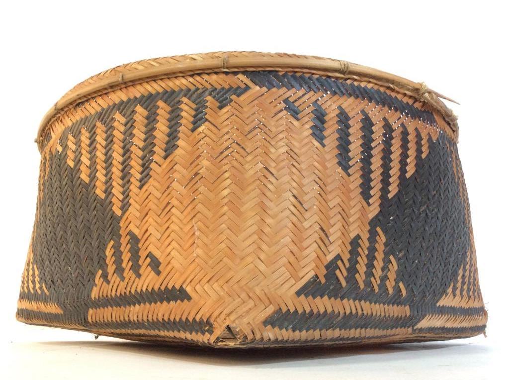Woven Tribal Style Basket: Basket appears to be vintage. Piece has Tribal style in weaving with tones of beige and brown. Piece measures approx 16 inches wide 8 inches tall. Basket, fruit basket, woven basket. tableware, cache 
