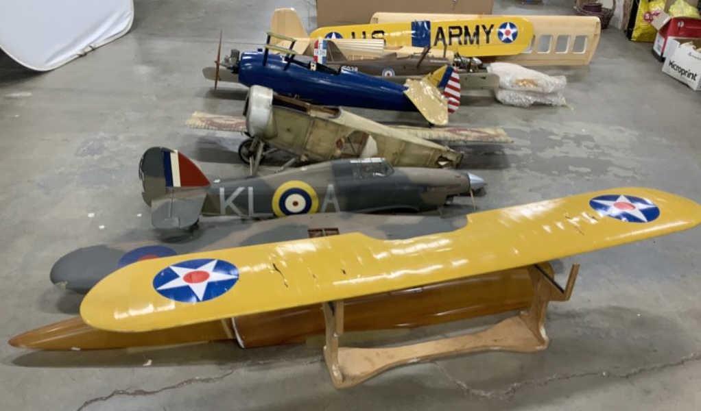 Group of Partial Radio Flyer Large Model Planes: From property of vintage manufacturer, pieces include bodies of planes, figurals seated in planes, painted wings, wheels, stands and more, largest measures length 7 inches, some have attached propelle