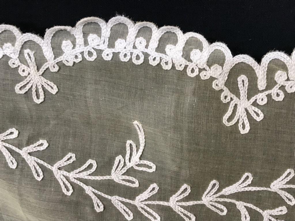 Yellow Appliqué Vintage Tablecloth: Scallop embroidered edges, rounded corners, center rectangular design that mimics border. All in white on yellow fabric, possibly organza. In bag that says ‘ Imported from a Switzerland by B. Altman
