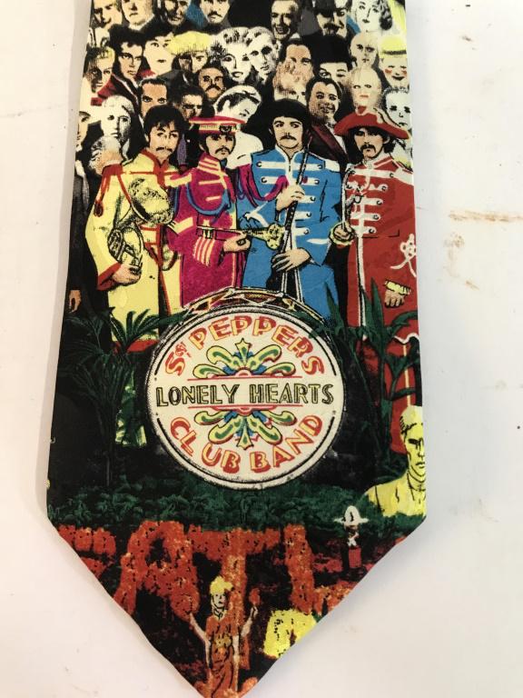 Designer Ralph Marlin ‘Beatles’ Shirt Tie, w Tag: Liscenced and Official. Never worn tie, Medallian at bottom reads ‘ St. Peppers Lonely Hearts Club Band’. Screen print on 100% silk. Made in USA. Printed on label reads ‘The BeatlesTM: St Pepper