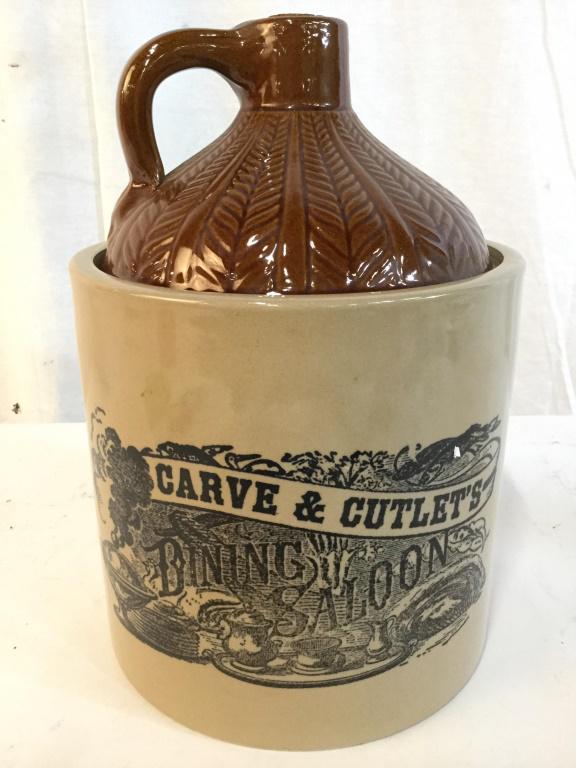 HOLT HOWARD Vintage Ceramic Jar W Lid: Jar is ceramic. Contains tones of black, sand and brown. Lid has handle and cork stopper. Pieces reads CARVE & CUTLETS DINING SALOON. Measures approx 11 inches tall 7 inches wide. decorative jar, vess