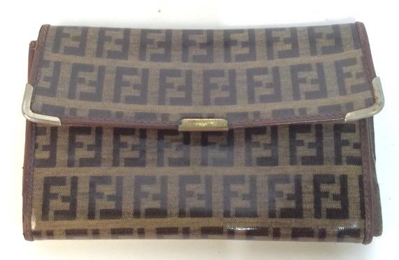 Vintage FENDI Italian Leather Wallet: Vintage fendi wallet made in Italy. Brown stitching. Outer design has Fendi logo. Button closure. Shows signs of wear. Folding Wallet. Fendi, Designer, Wallet, Fendi Wallet, coin purse, money, vintage