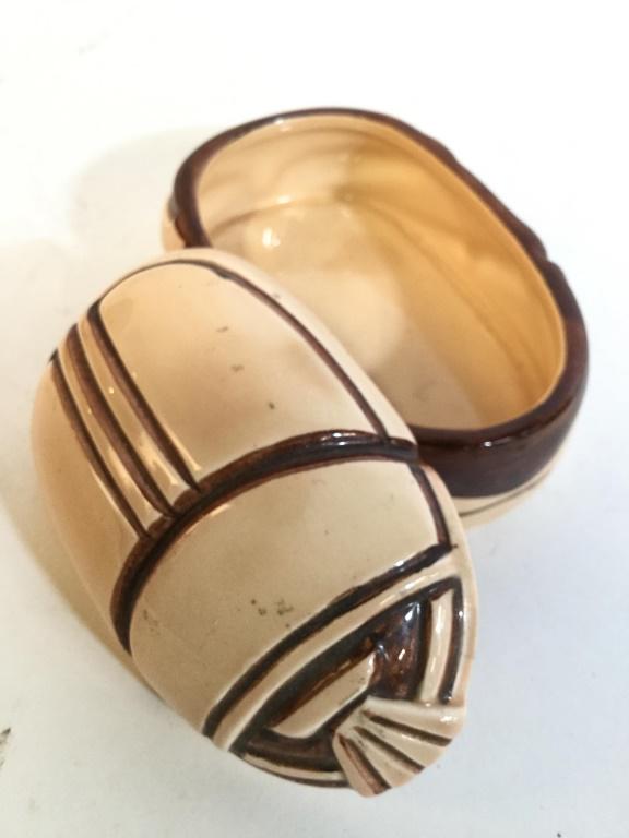 TIFFANY & CO Beetle Shaped Porcelain Trinket Box: Underside of piece is marked TIFFANY & CO. Piece has shape of beetle. Trinket Box is Porcelain. Piece appears to possibly be hand painted. Measures approx 3.5 inches long 2 inches tall 2.5 inches wide